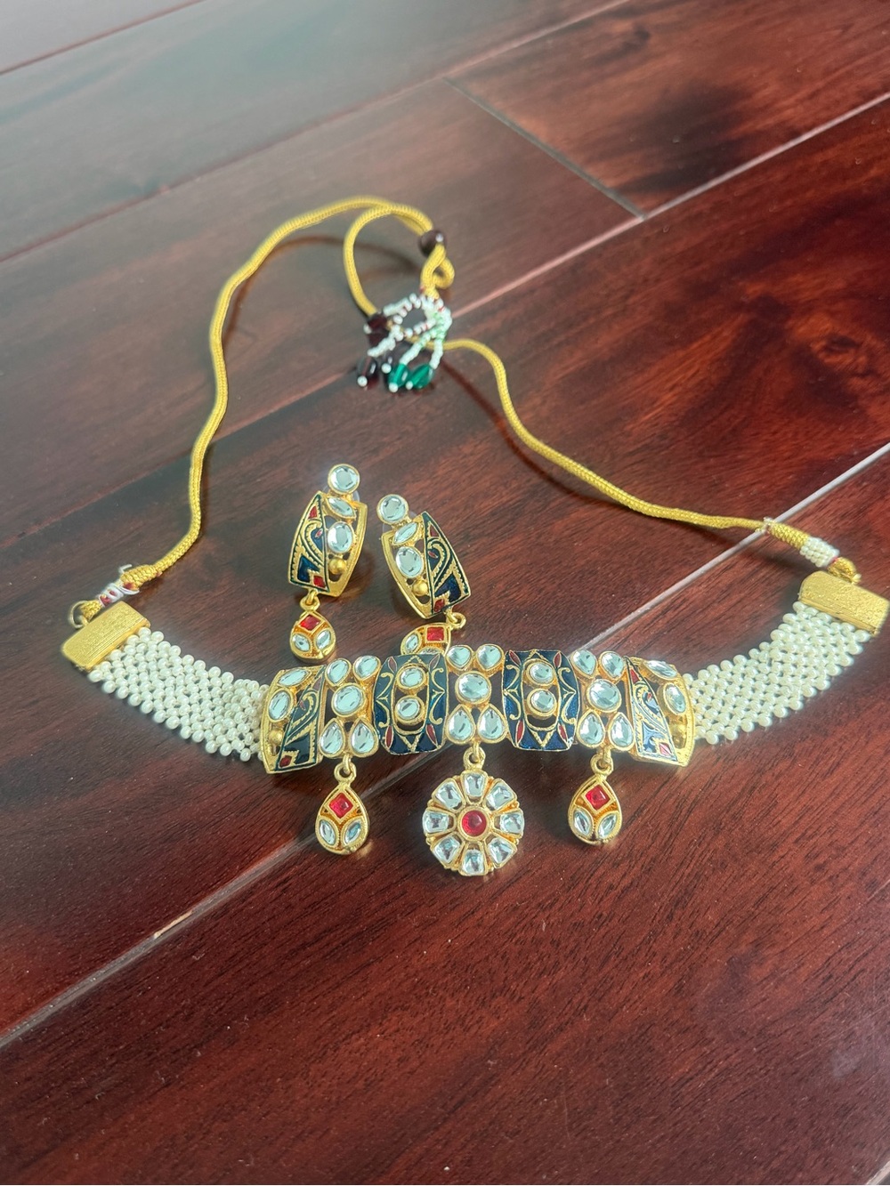 Gold-Tone Kundan Necklace Set with Green and Red Accents